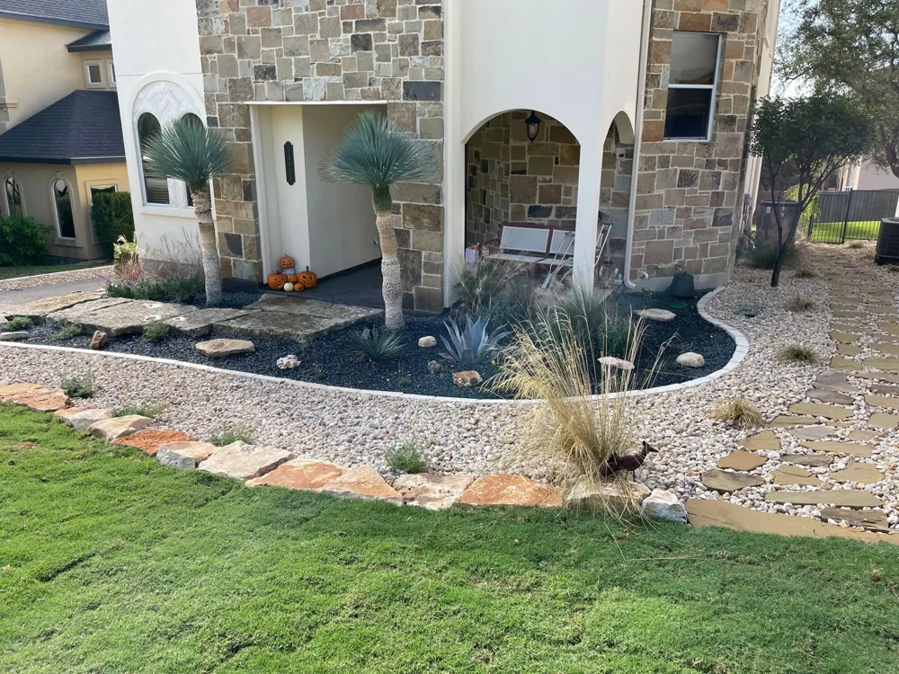 Layered water-wise planting with stone-edged beds