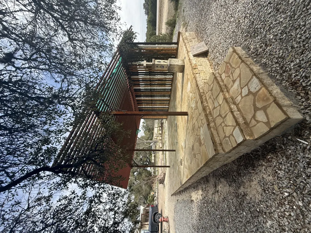 Covered outdoor gathering space with masonry patio